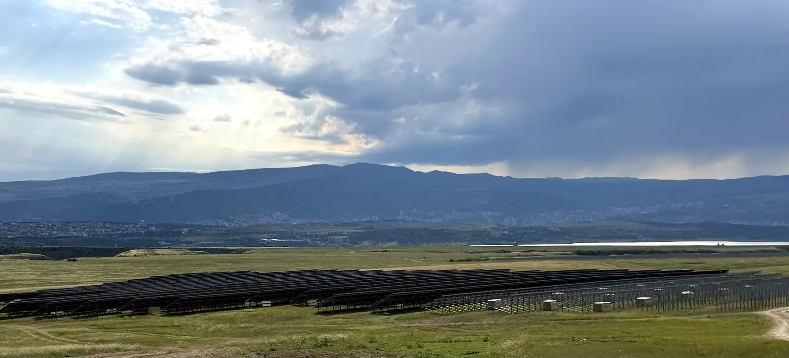Mukhiani One solar plant, with Tbilisi and the Tbilisi Sea area below